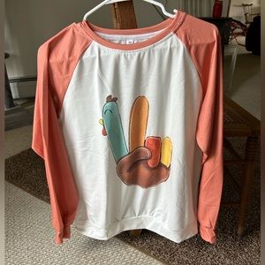 Festive Thanksgiving turkey shirt.